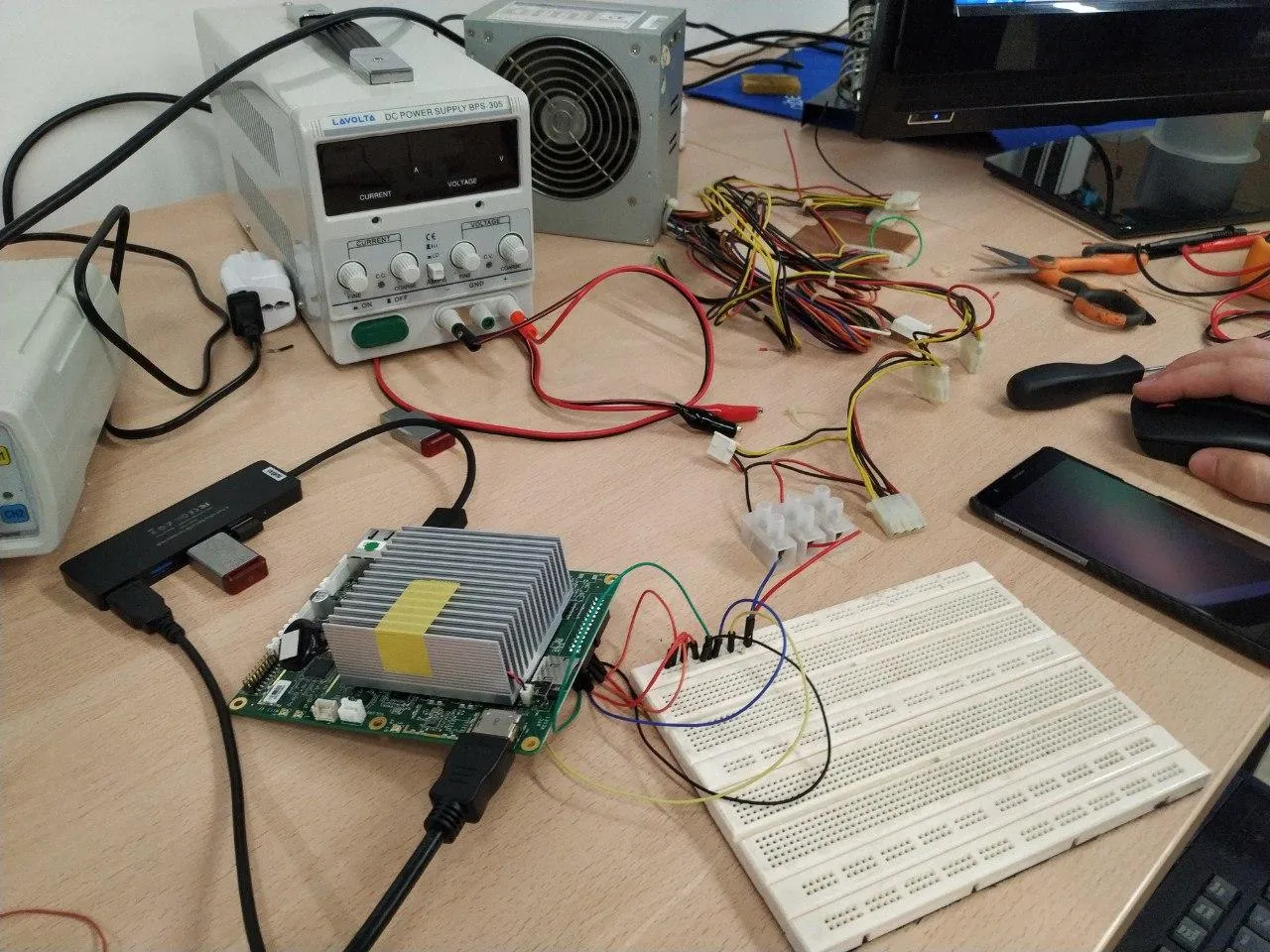 Bench top power supply shoddily feeding the Atomic Pi via Dupont wire jumpers